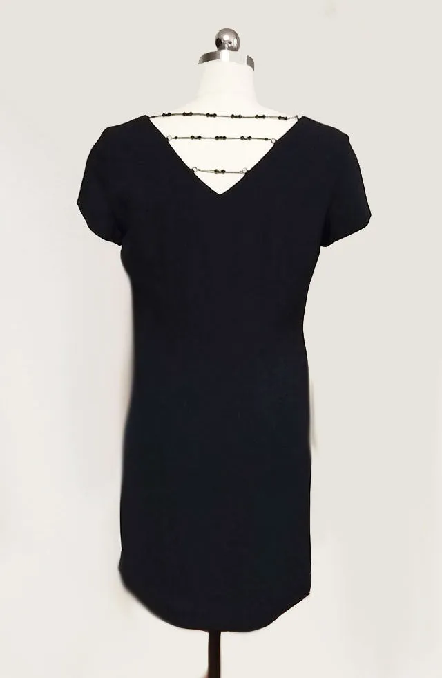 THE "LITTLE BLACK DRESS" IN CREPE ADORNED WITH 3 ROWS OF SPARKLING BEADS IN BACK